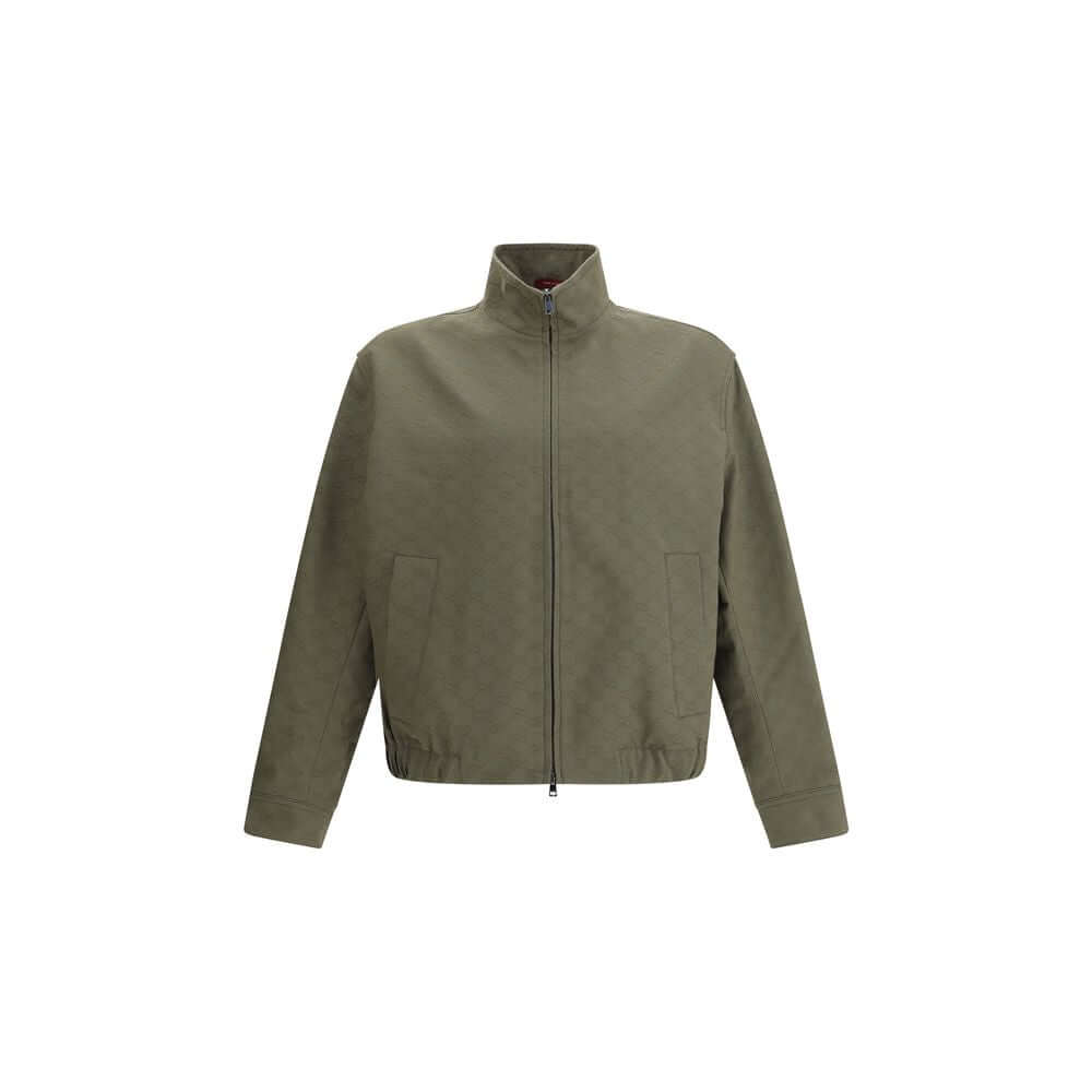 Gucci Green Cotton Bomber with high collar and front zipper, featuring GG Supreme design, ribbed cuffs, and side pockets for AW25.