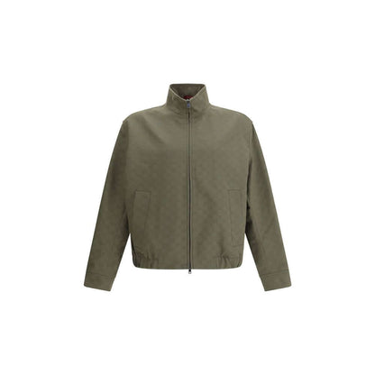 Gucci Green Cotton Bomber with high collar and front zipper, featuring GG Supreme design, ribbed cuffs, and side pockets for AW25.