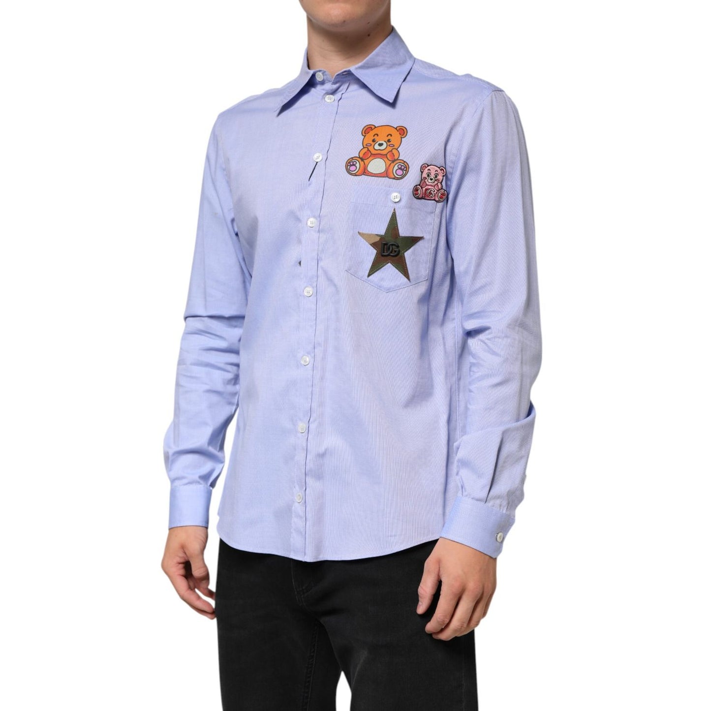Man wearing Dolce & Gabbana Light Blue Cotton Teddy Bear Long Sleeve Shirt with star appliqués.