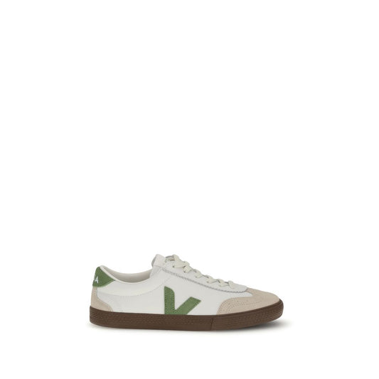 Veja White Leather Low Top Sneakers with green logo, inspired by 1970s Brazilian volleyball shoes. Features rounded toe and flat sole.