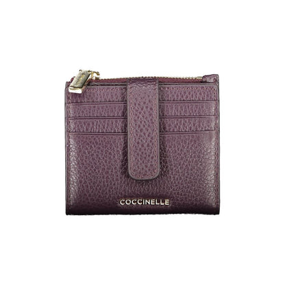 Coccinelle Purple Leather Women Wallet featuring lustrous purple leather, multiple card slots, and embossed logo for elegant style and functionality.
