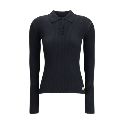 Dolce & Gabbana Black Cashmere Polo Shirt with ribbed design, classic collar, and three-button closure, perfect for elegant outfits.