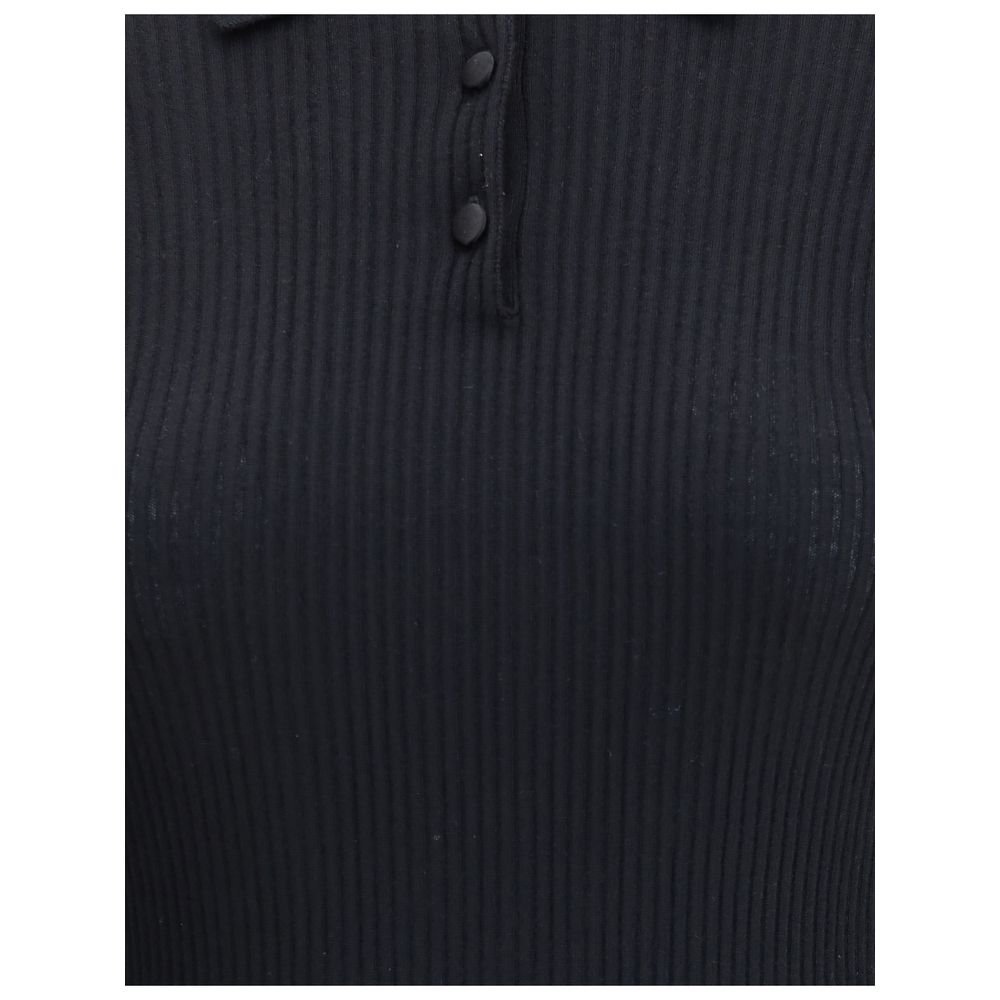 Dolce & Gabbana Black Cashmere Polo Shirt with ribbed design and three-button closure for a refined and versatile style.