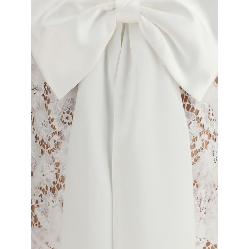 Close-up of white lace and oversized satin bow on Self-Portrait White Nylon Casual Dress with U-shaped back neckline, AW25 collection.