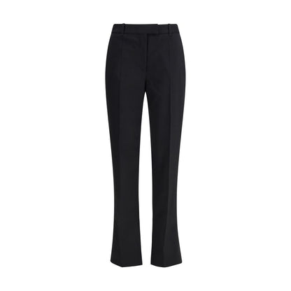 Alexander McQueen Black Wool Dress Pants with pleated tapered leg and elegant tailoring, Autumn Winter 25 collection.