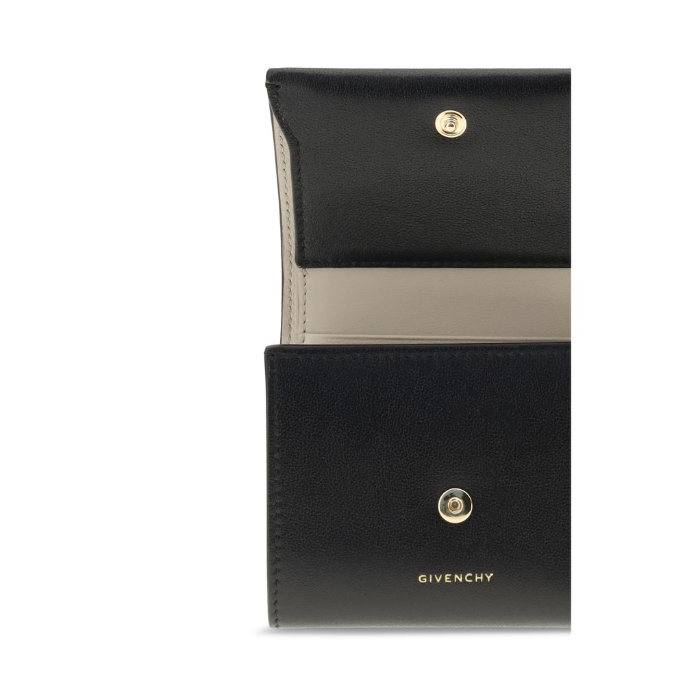 Open view of Givenchy Black Lamb Leather Wallet showing card slots and gold snap closure.