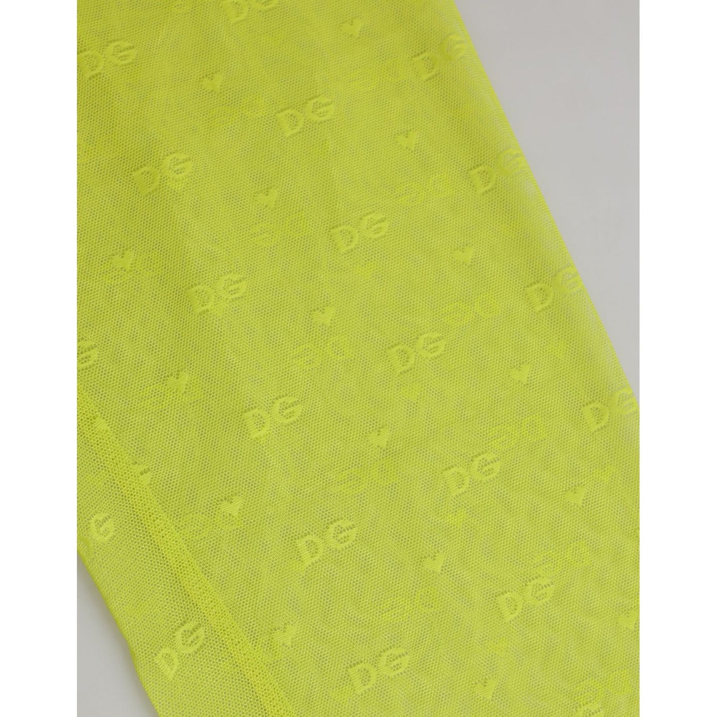 Close-up of Dolce & Gabbana Neon Green Nylon Logo Lace Leggings Pants Underwear fabric showing logo details.