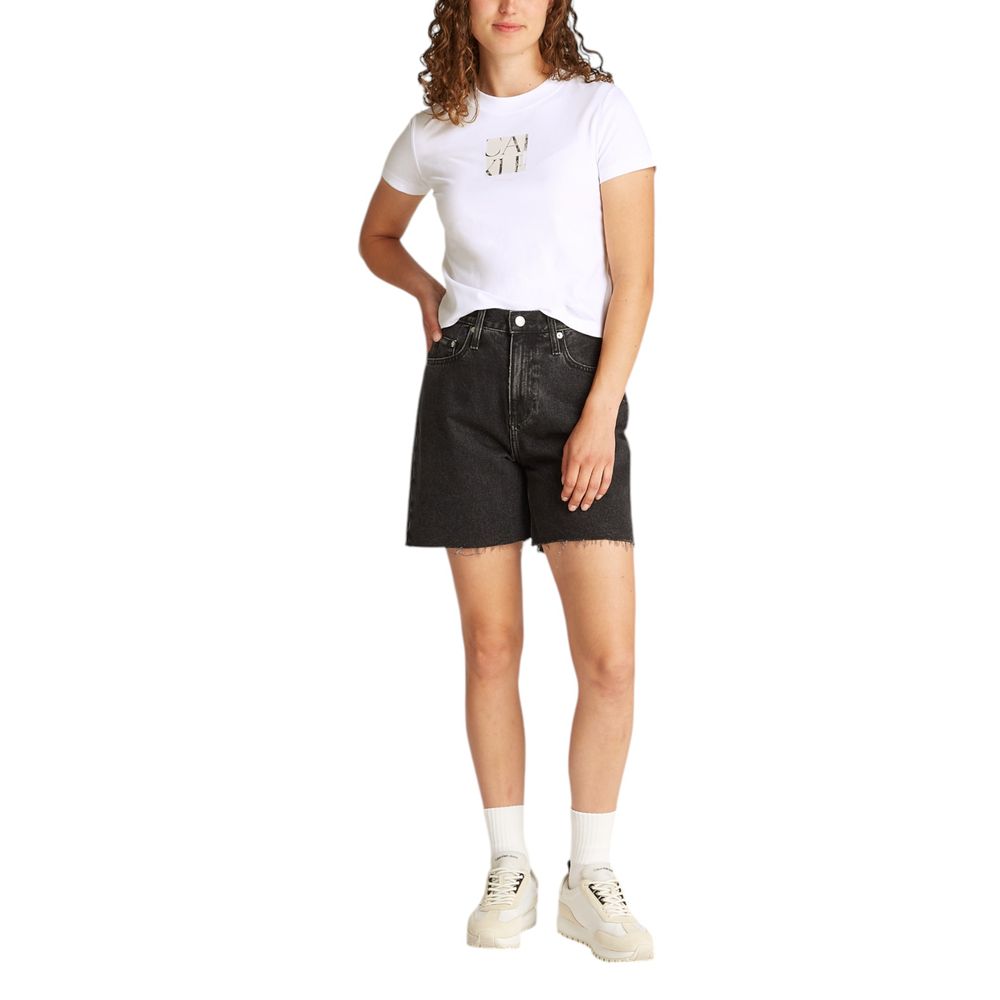 Model wearing Calvin Klein Jeans White Recycled Cotton T-Shirt with black shorts and white sneakers.