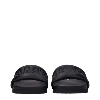 Ambush Black Leather Slippers with front logo, open toe design, and rubber sole, street style footwear for casual wear.