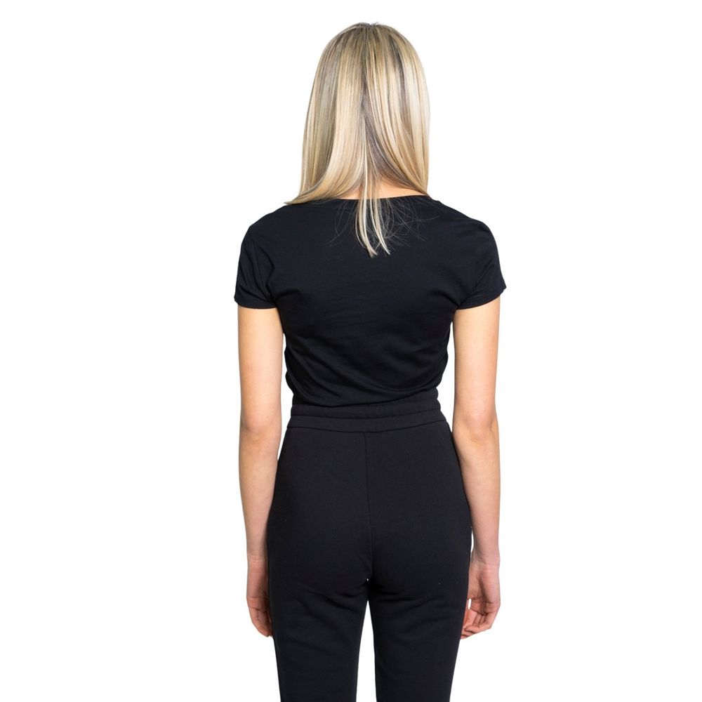 Back view of woman wearing Armani Exchange Black Cotton T-Shirt, showcasing its elegant and versatile design.
