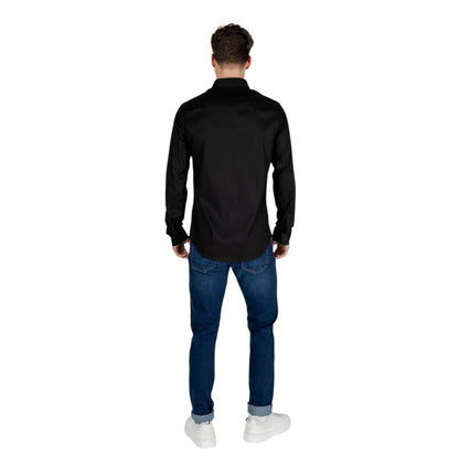 Back view of a man wearing an Armani Exchange Black Lyocell Shirt, showcasing stylish design and classic fit.