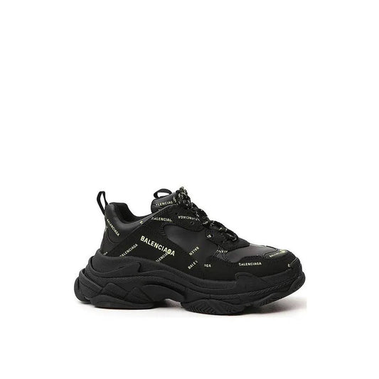 Balenciaga Black Calfskin Chunky Sneakers with round toe, all-over logo, and lace-up closure, featuring a rubber sole.