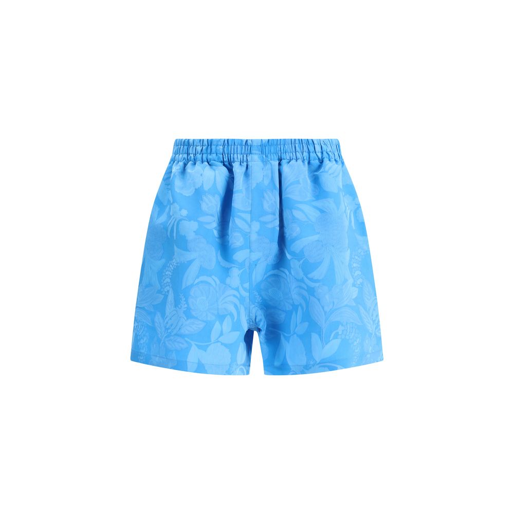 Balenciaga Blue Viscose Bermuda Shorts with floral pattern, elasticized waistband, and side welt pockets for a bold summer look.