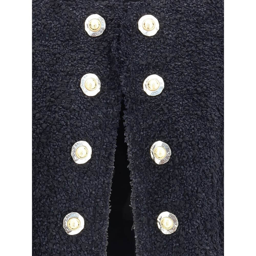 Close-up of Balmain Black Polyamide Coat with gold buttons, displaying luxury and elegance in design.