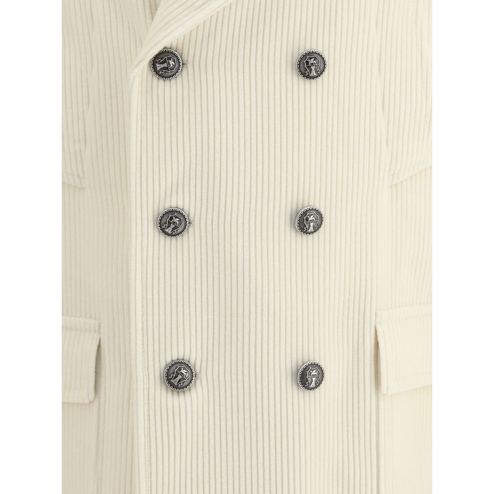 Close-up of Brunello Cucinelli Cream Cashmere Coat with ribbed texture and metal button details.