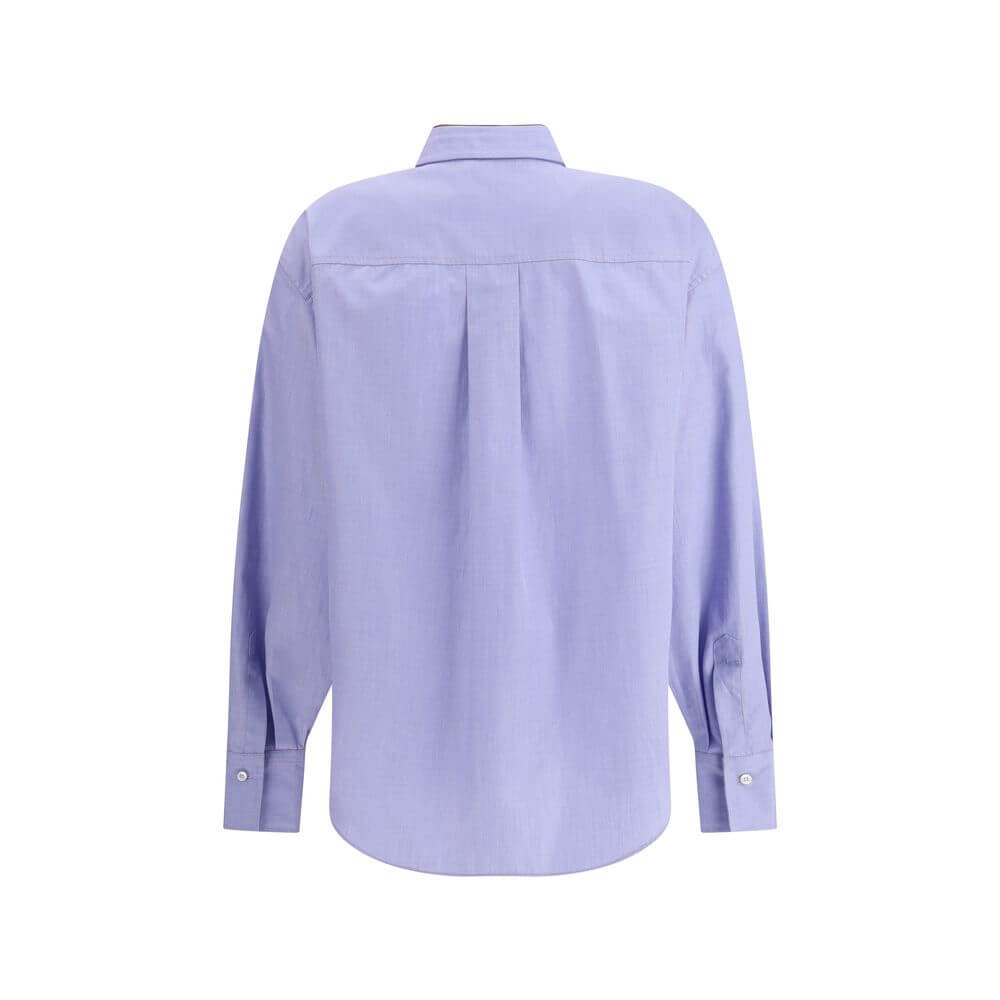 Back view of Brunello Cucinelli Light Blue Cotton Dress Shirt with classic collar and buttoned cuffs, showcasing asymmetrical hemline.