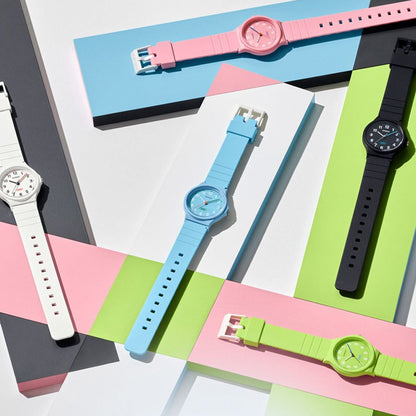 Colorful wristwatches including CASIO TIMELESS COLLECTION Mod. POP - BIO RESIN STRAP - WHITE displayed on a geometric background.