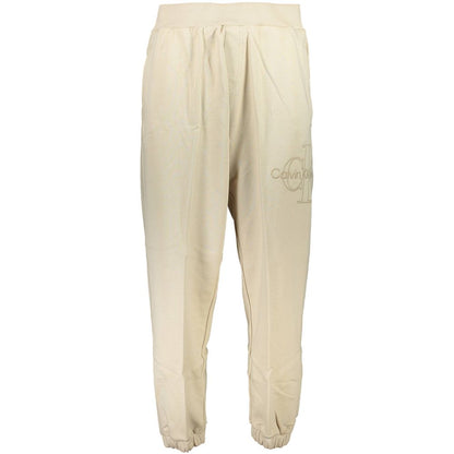 Calvin Klein Beige Cotton Pant featuring elastic waist and ankles, 3 pockets, with logo embroidery. Made from 50% transitional cotton.