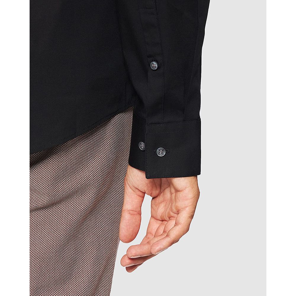 Close-up of Calvin Klein Black Cotton Dress Shirt sleeve with buttoned cuff, showcasing sophisticated design and slim fit for men.