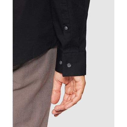 Close-up of Calvin Klein Black Cotton Dress Shirt sleeve with buttoned cuff, showcasing sophisticated design and slim fit for men.