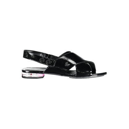 Calvin Klein Black Leather Women Sandal with 1cm heel, elegant crossed front, and iconic logo for minimalist chic fashion.