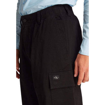 Close-up of Calvin Klein Jeans Black Cotton Cargo Pants with logo detail and side pocket, showcasing comfortable fit and quality design.