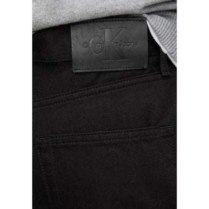 Calvin Klein Jeans Black Cotton Relaxed Fit Jeans close-up showing label and pocket details.