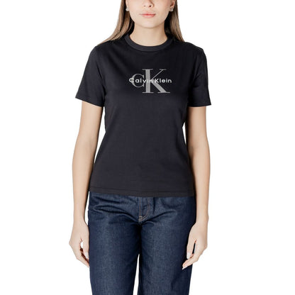 Woman wearing Calvin Klein Jeans Black Cotton T-Shirt with logo, styled with blue jeans, perfect for casual spring and summer fashion.