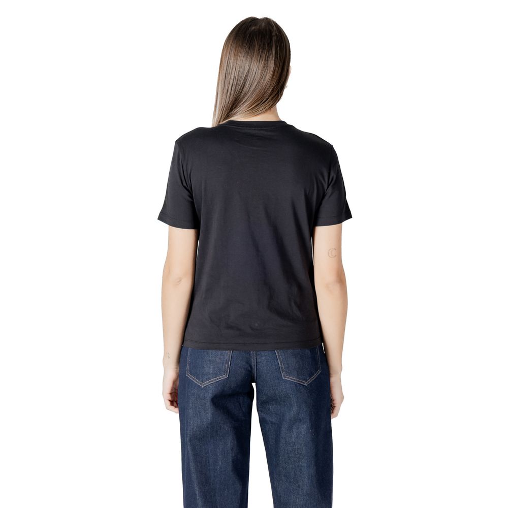 Back view of Calvin Klein Jeans Black Cotton T-Shirt for women showcasing minimalist design and comfort.