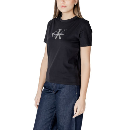 Woman wearing Calvin Klein Jeans Black Cotton T-Shirt with logo, paired with dark jeans for a chic casual look.