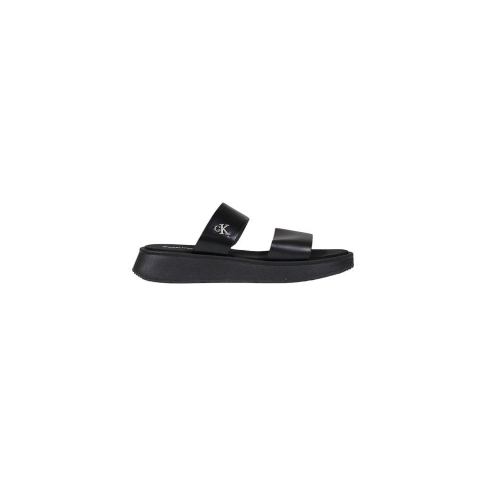 Calvin Klein Jeans Black Leather Flat Sandals with minimalist design and durable sole for summer elegance.