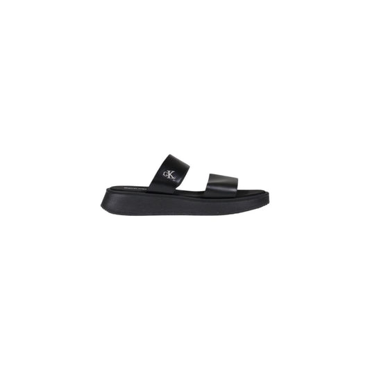 Calvin Klein Jeans Black Leather Flat Sandals with minimalist design and durable sole for summer elegance.