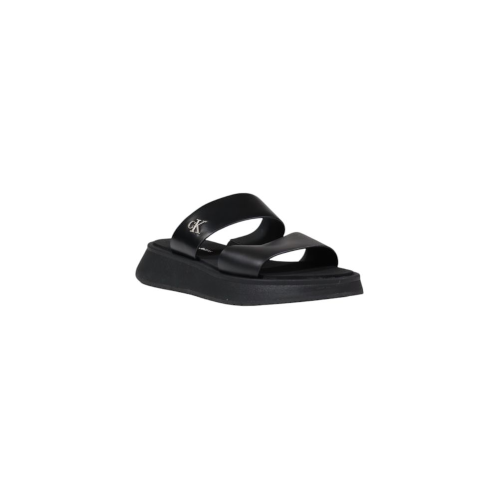 Calvin Klein Jeans Black Leather Flat Sandals with minimalist design and logo detail, ideal for summer fashion and versatile wear.
