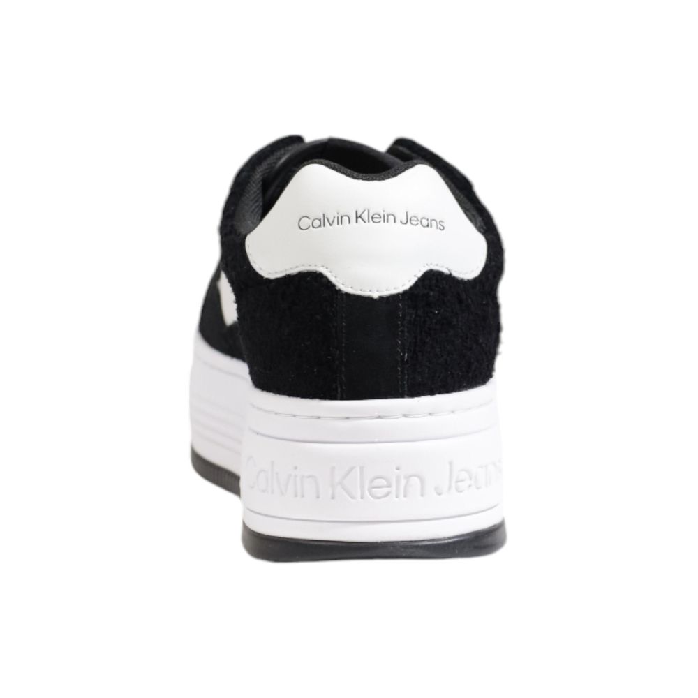 Back view of Calvin Klein Jeans Black Leather Platform Sneakers showcasing logo detail.