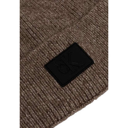 Close-up of Calvin Klein Jeans Brown Marabou Cap showing textured fabric and distinctive rubberized label, ideal for adding style to outfits.