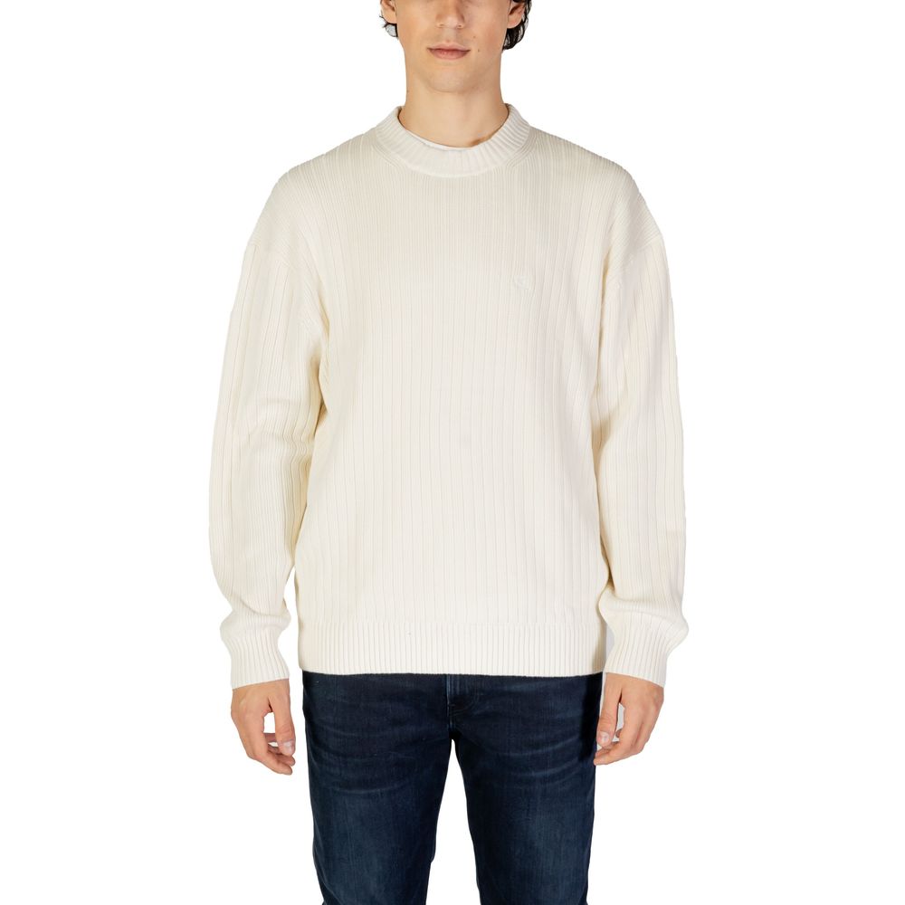 Calvin Klein Jeans Cream Cotton Sweatshirt with ribbed texture on model, showcasing contemporary style and comfort.
