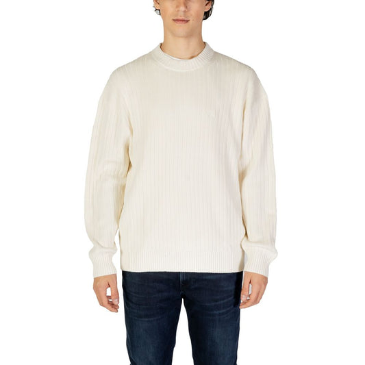 Calvin Klein Jeans Cream Cotton Sweatshirt with ribbed texture on model, showcasing contemporary style and comfort.