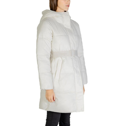 Woman wearing Calvin Klein Jeans Cream Nylon Coat with logo belt, side view showing modern and enveloping silhouette.