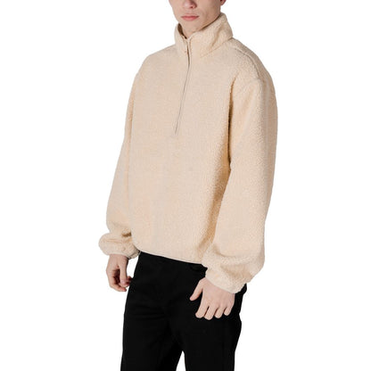 Man wearing Calvin Klein Jeans Cream Recycled Polyester Shell Jacket, half-zip design for modern style and comfort.