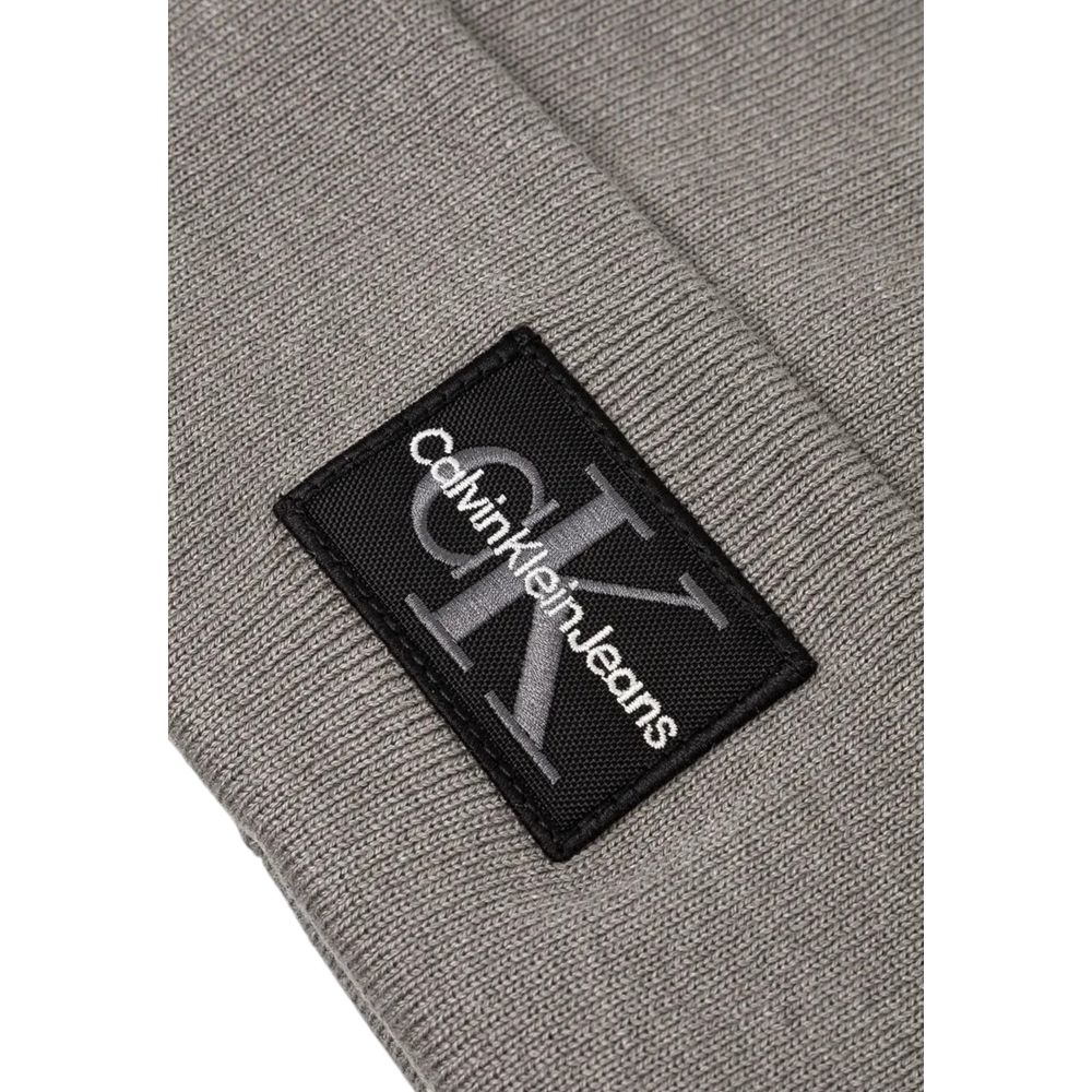 Calvin Klein Jeans Gray Cotton Cap (Baseball Hat) with logo patch detail showcasing CK branding.