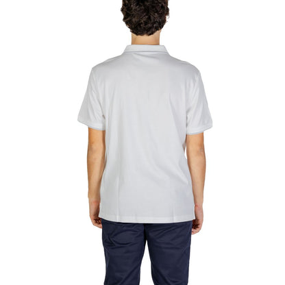 Back view of a man wearing a Calvin Klein Jeans White Cotton Polo Shirt, showcasing its modern fit and clean design.