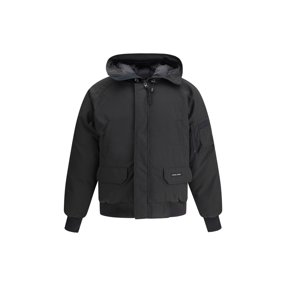 Canada Goose Chilliwack Bomber Jacket, black padded design with hood, concealed zipper, snap buttons, and branded patch on sleeve.