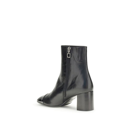 Carel Paris Black Leather Ankle Boots with patent toe and flared heel, shown from side with zip closure for AW25 season.