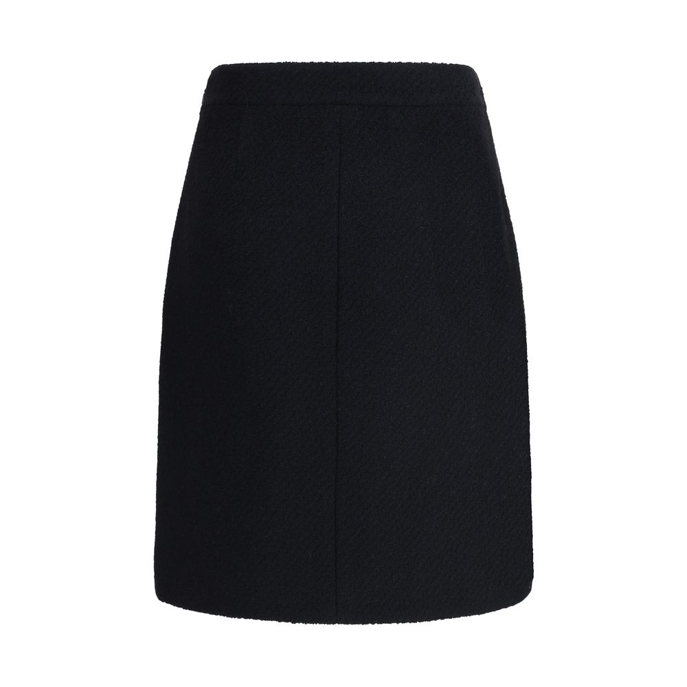 Chloé Black Wool Midi Skirt with front flap pockets and gold-tone buttons, crafted from premium bouclé wool for AW25 Season.