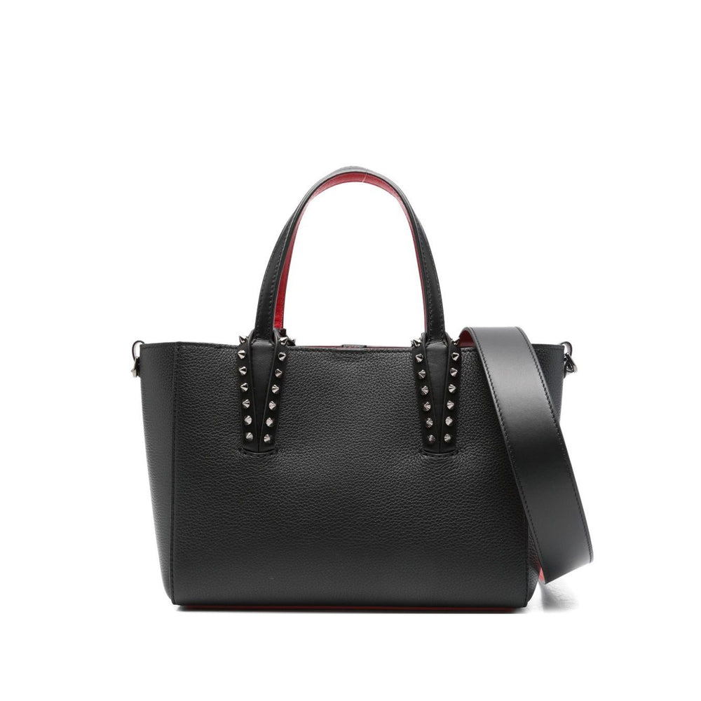 Christian Louboutin Cabata mini leather tote bag with black spiked studs, flat top handles, and detachable shoulder strap.