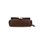 Bottom view of Coach Tabby 26 Shoulder Bag in chestnut brown nappa leather with quilted design and golden C logo plaque.