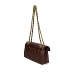 Coach Tabby 26 Shoulder Bag in chestnut brown nappa leather with quilted design and chain-link strap, rear pocket visible
