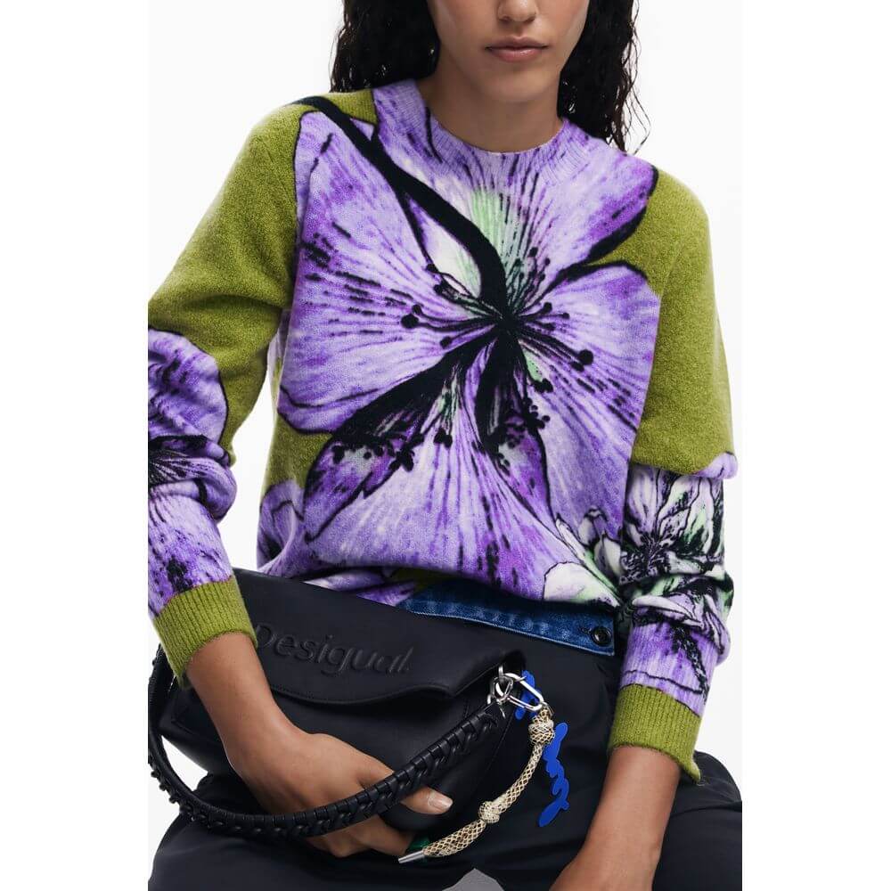 Woman in Desigual Purple Elastane Women Sweater with floral design, holding a black handbag, showcasing chic and vibrant fashion.