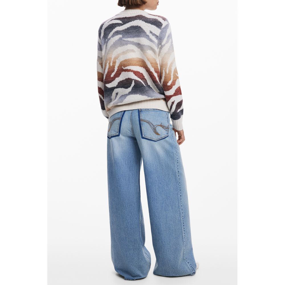 Model wearing Desigual White Polyamide Women Sweater with bold patterns, paired with wide-leg jeans from the back view.