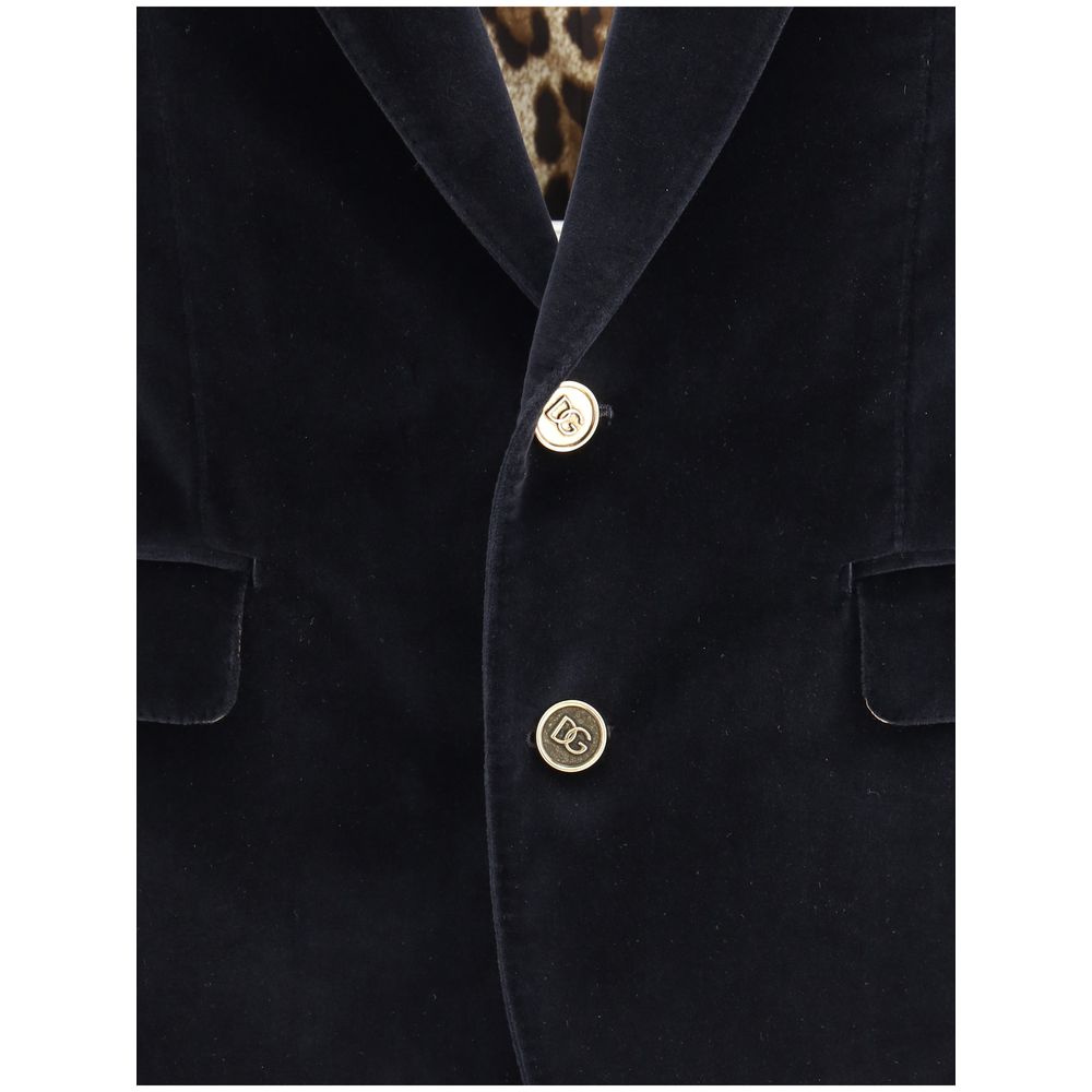 Dolce & Gabbana Black Cotton Blazer with velvet finish and gold button details, featuring rounded peak lapels for a formal look.